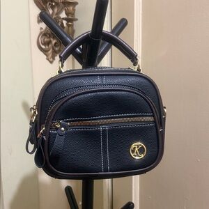 Black Crossbody Bag with Pink Strap